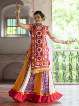 Red circular traditional embroidered panel top paired with multi color flairy skirt